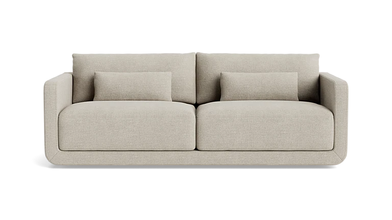 The Eva 85" Sofa is a modern beige piece featuring a minimalist design with straight armrests, two large seat cushions, and two smaller back cushions. It is showcased against a plain black background.