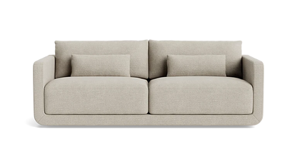 The Eva 85" Sofa is a modern beige piece featuring a minimalist design with straight armrests, two large seat cushions, and two smaller back cushions. It is showcased against a plain black background.