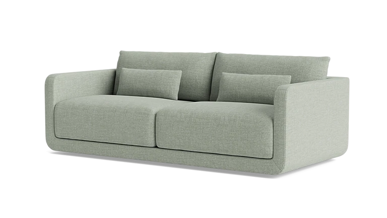 The Eva 85" Sofa is a modern piece in light green featuring two large seat cushions, two back cushions, and two smaller rectangular pillows. Its sleek and contemporary design includes straight armrests and exudes a minimalist style.