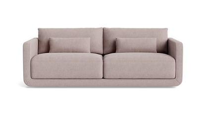 An 85-inch Eva sofa in beige, showcasing clean lines and a minimalist design with two large seat and back cushions, set against a plain black background.