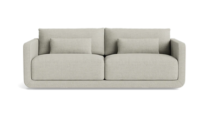 A modern, minimalist two-seater Eva 85" Sofa in beige features clean lines and comes with two matching rectangular cushions on each seat, enhancing its comfortable and stylish look against a black background.