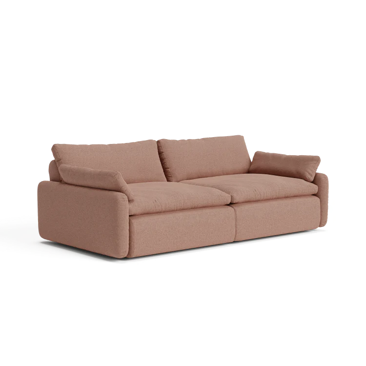 Introducing The Sink Down Sectional: a plush, brown fabric sectional with thick cushions and wide armrests crafted for ultimate comfort. Featuring a modern, boxy design, this sofa comfortably seats three people and sits on a flat surface, exuding a cozy and inviting vibe.