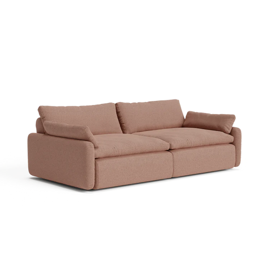 Introducing The Sink Down Sectional: a plush, brown fabric sectional with thick cushions and wide armrests crafted for ultimate comfort. Featuring a modern, boxy design, this sofa comfortably seats three people and sits on a flat surface, exuding a cozy and inviting vibe.