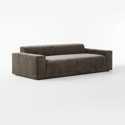 A contemporary, minimalist Faible 100" sofa featuring wide armrests and a low backrest, upholstered in subtly textured white performance fabric, set against a plain white background.