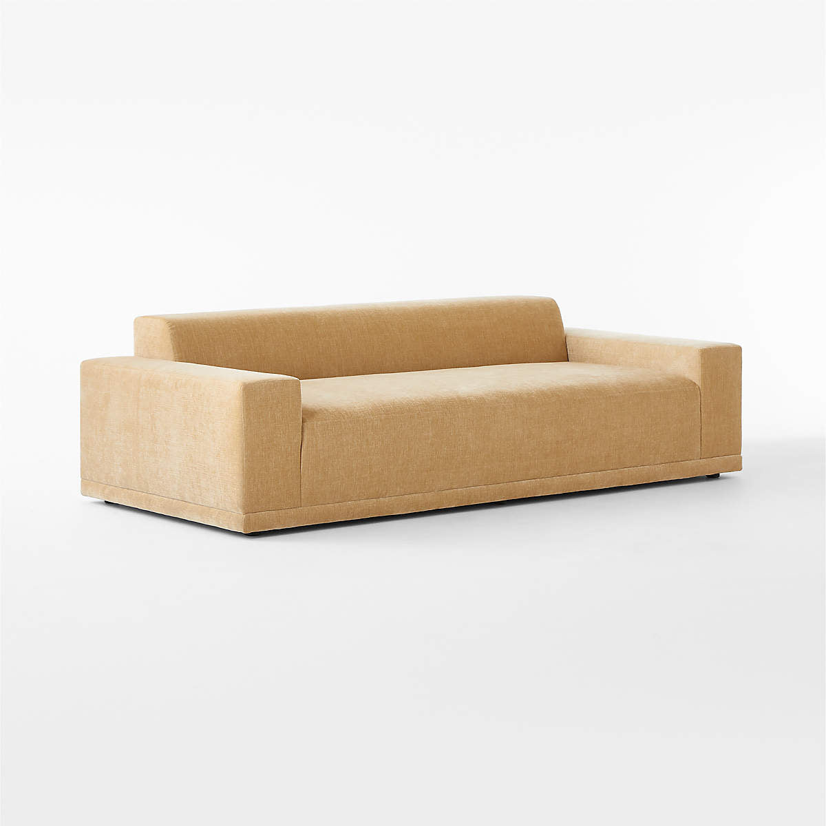 Introducing the Faible 100" White Performance Fabric Sofa—a contemporary piece featuring a minimalist design with a boxy shape and upholstered in performance fabric. It boasts a low backrest and armrests, all supported by a sleek, flat base against a plain white background.