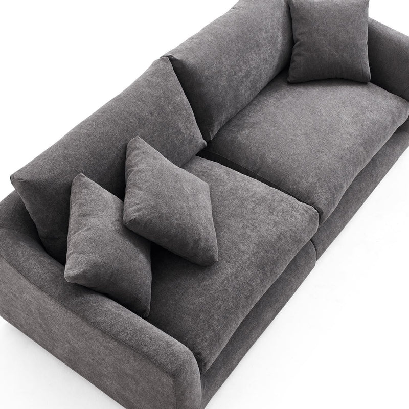 A top view of the Feathers 3-Seater Sofa, a modern gray fabric piece with four square cushions. It boasts a minimalist design characterized by clean lines and a plush, comfortable appearance, all set against a plain white background.