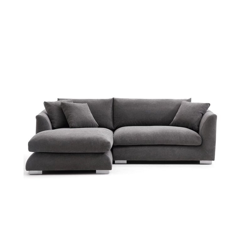 The Feathers 88" Left Facing Sectional is a contemporary piece in dark gray, featuring plush cushions and minimalist design, complete with a chaise on the left side. It is styled against a white background.