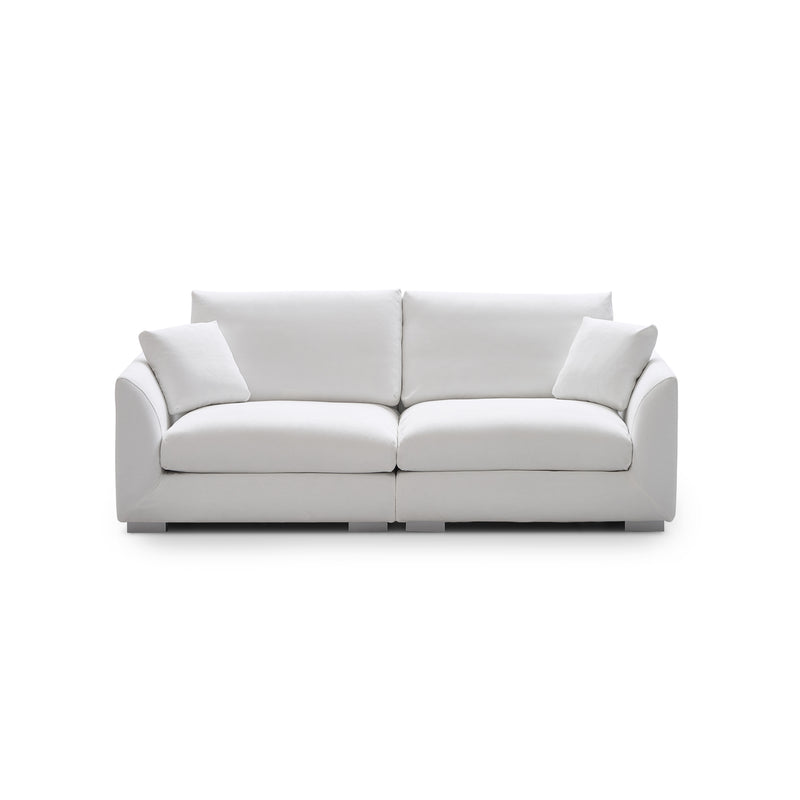 Introducing the Feathers 3-Seater Sofa, a sleek and modern white sofa accompanied by two matching cushions. Set on a plain white background, this sofa features a minimalist design with smooth, rounded armrests and plush seating, epitomizing clean elegance.