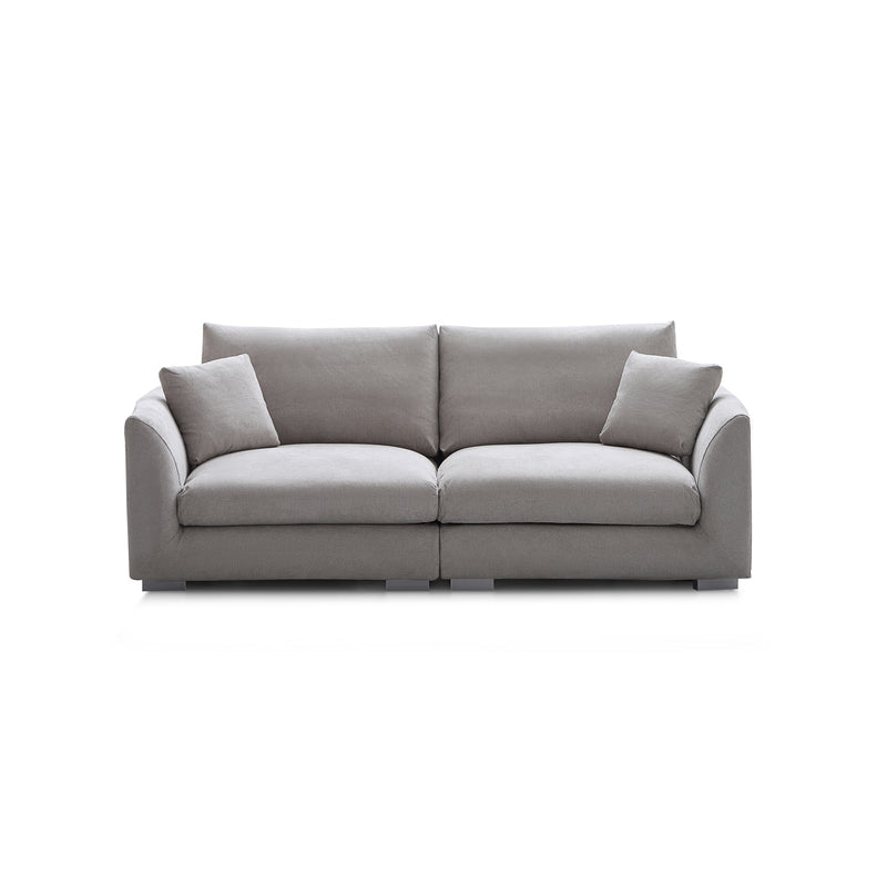 The Feathers 3-Seater Sofa boasts a sleek gray appearance and features a minimalist design, complete with two spacious seat cushions and two coordinating square pillows set against a white background.