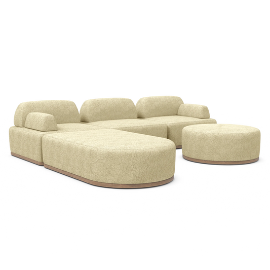 Introducing the Magna Preconfigured Sectional—a contemporary, beige-colored modular sofa with rounded edges, paired with a coordinating round ottoman. This sofa boasts plush cushions and a sleek texture, all displayed against a simple white background.