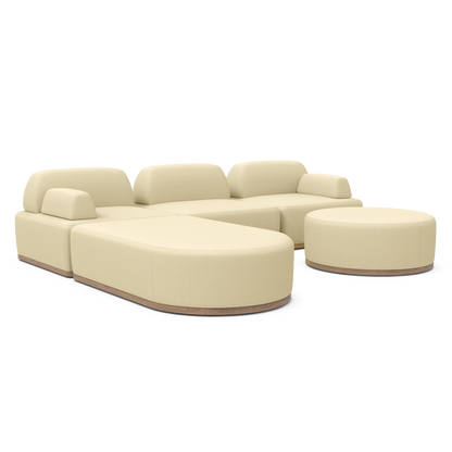 A contemporary cream Magna Preconfigured Sectional with modular curved edges and a coordinating round ottoman, all set against a white backdrop. It showcases cushioned backrests and smooth finishes, with a wooden base subtly exposed beneath.