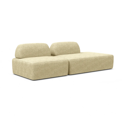 Introducing the Magna Preconfigured Sectional: a beige two-piece modular sofa featuring low-profile cushions and a minimalist design against a white backdrop.