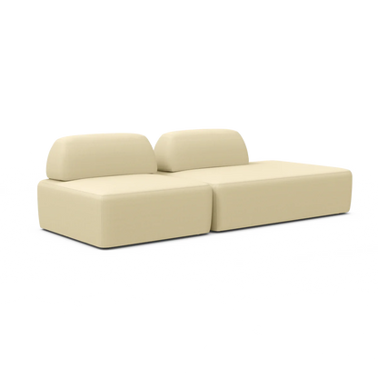 The Magna Preconfigured Sectional is a beige modular sofa that features two sections and two backrests. Its fabric is soft and modern, crafted for comfort and style in a contemporary living space.