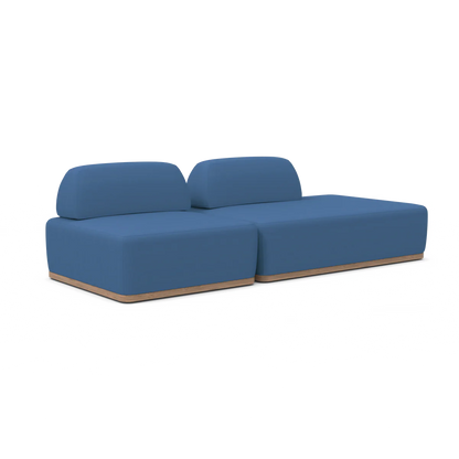 Introducing the Magna Preconfigured Sectional: a modern two-seater sofa in a stylish blue color, featuring a minimalist design with a wooden base. It is equipped with two backrests and boasts a sleek, low-profile appearance, all showcased against a plain white background.