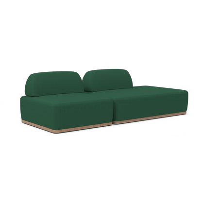 The Magna Preconfigured Sectional is a modern green sofa featuring two distinct backrests and a sleek wooden base, perfectly showcased against a plain white background. It is ideal for stylish and minimalist interiors.