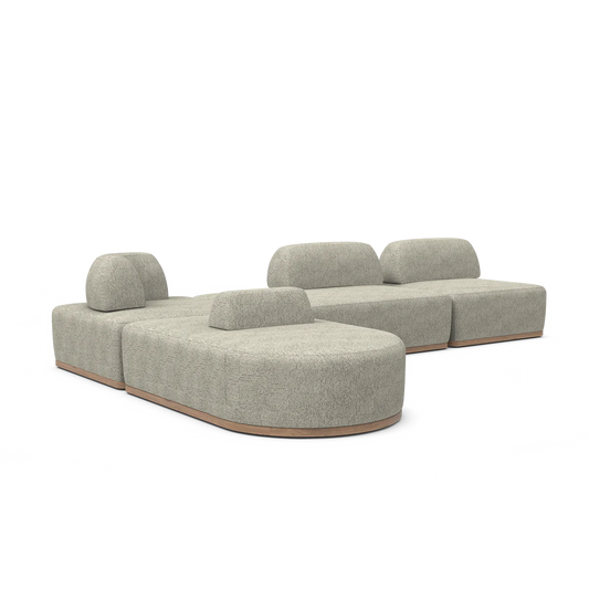 The Magna Preconfigured Sectional is a modular, beige sofa with a contemporary design. It features rounded edges, multiple cushioned sections, and rests on a low wooden base.