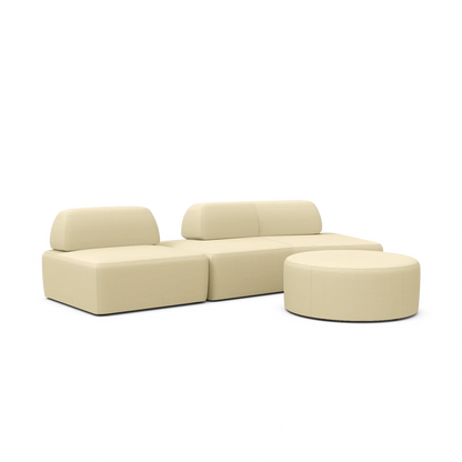 A Magna Preconfigured Sectional in beige, featuring interchangeable sections with an oval shape, paired with a round ottoman, is arranged on a white background.