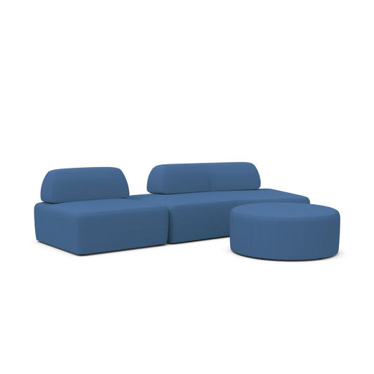 The Magna Preconfigured Sectional is a modular blue sofa set, featuring three seating sections and a circular ottoman, with smooth upholstery and a contemporary design, all showcased against a plain white background.