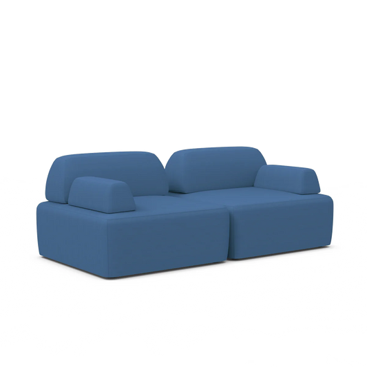 Introducing the Magna Preconfigured Sectional: a sleek and contemporary modern blue sofa with a minimalist design. This sectional features thick cushions and low backrests set against a white background, complemented by block-like armrests for an elegant appearance.