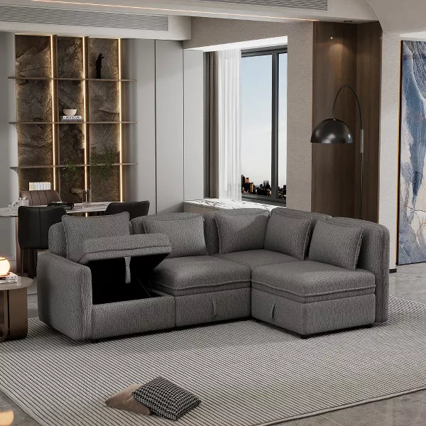 A modern living room showcases the 122.8" Minimalist Convertible Modular Sofa, an upholstered sectional couch with 5 pillows by ModernLuxe, placed on a textured rug. Behind the sofa is a built-in shelf adorned with decorative items. A large window provides a view, and nearby stands a contemporary floor lamp featuring a curved arm.