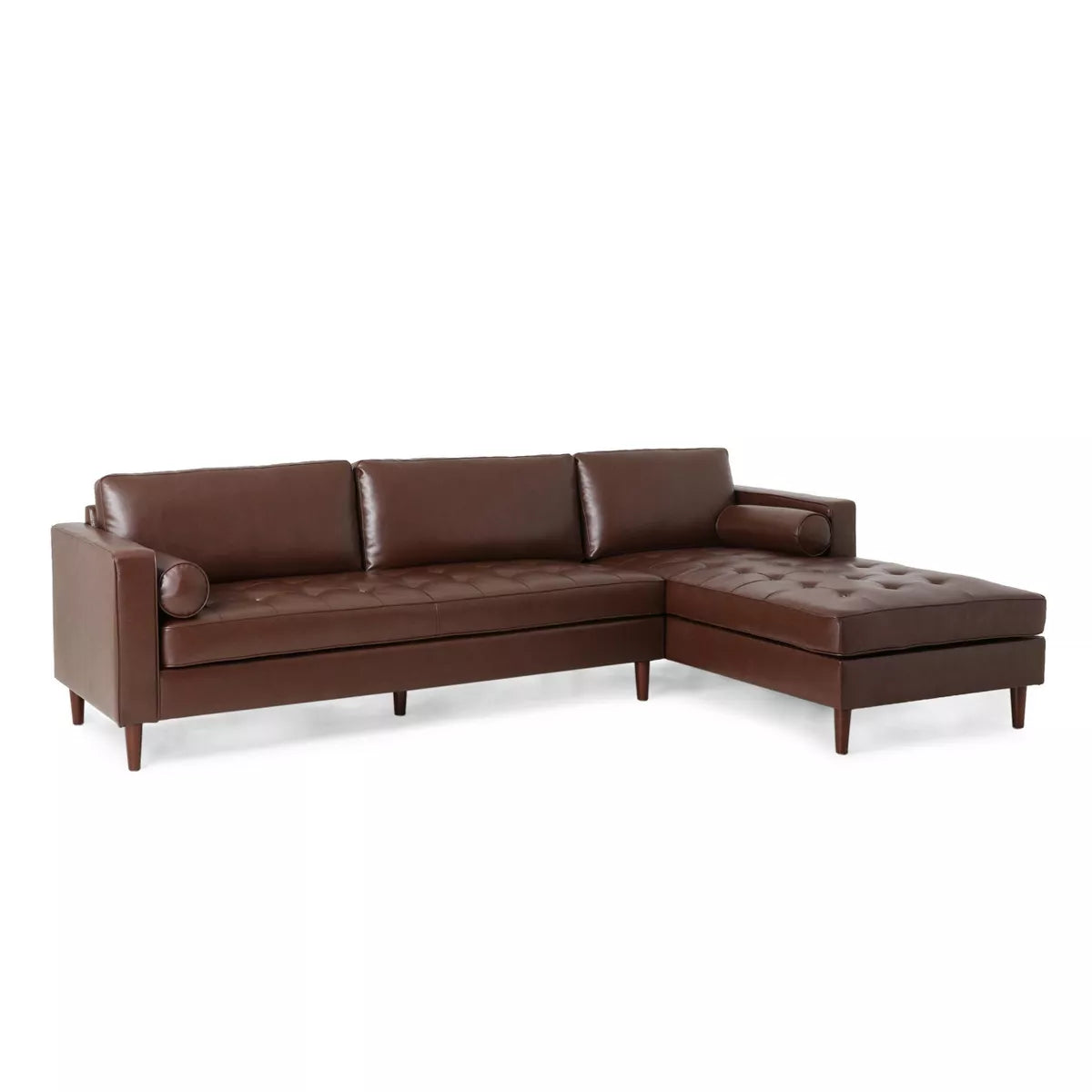 Introducing the Malinta Contemporary Tufted Upholstered Chaise Sectional by Christopher Knight Home: a modern brown leather sectional sofa featuring a chaise lounge on the right side, tufted seating, three back cushions, two cylindrical pillows, clean lines, and elegant wooden legs.