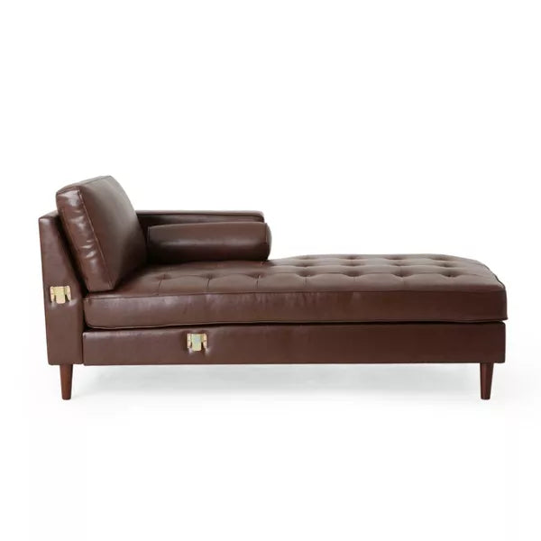 The Malinta Contemporary Tufted Upholstered Chaise Sectional by Christopher Knight Home features a brown leather design with a tufted seat, angled backrest, and cylindrical bolster pillow. Sophisticated wooden legs and brass accents enhance its elegance, set against a white background.