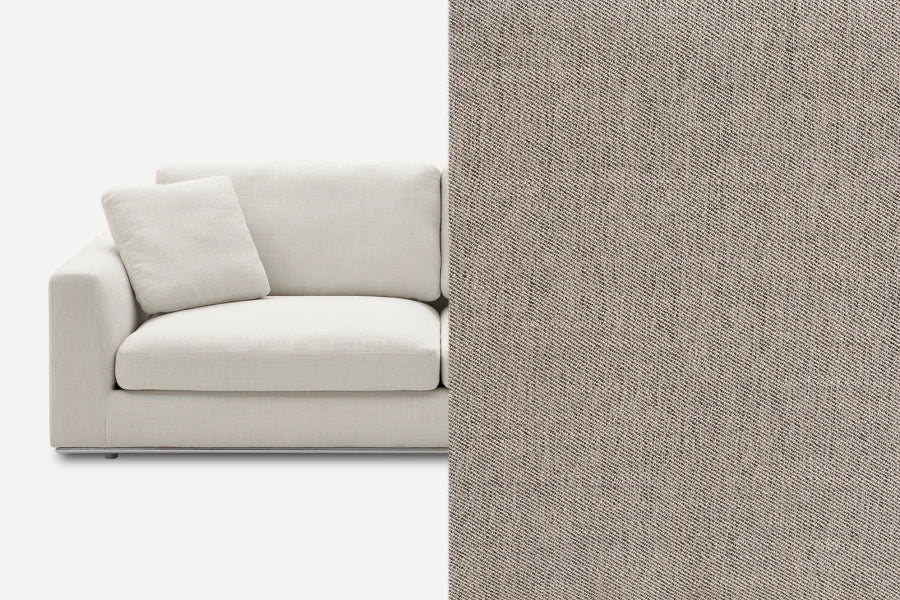 A light gray upholstered sofa with a matching cushion is shown on the left. On the right is a close-up texture of the sofa’s fabric, displaying a detailed pattern of interwoven threads in shades of gray.