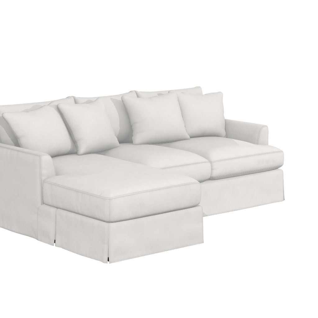 Introducing the Ava Chaise Slipcovered Sofa: a white sectional couch adorned with multiple cushions, featuring a chaise lounge on one side and covered in smooth fabric, all showcased against a plain white background.