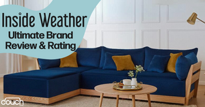 A modern living room features a blue sectional sofa with mustard yellow accent pillows. A wooden coffee table with decor items sits on a rug. An overhead lamp peeks into the frame. Text reads "Inside Weather Ultimate Brand Review & Rating." Logo: Couch.com.