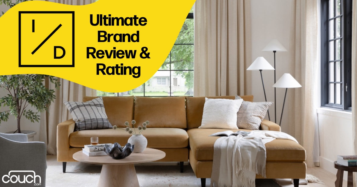 A cozy living room features a mustard yellow sectional sofa adorned with cushions and a throw blanket. In front is a round wooden coffee table. Large windows let in natural light, and a modern floor lamp stands on the right. Text overlay: "Ultimate Brand Review & Rating.