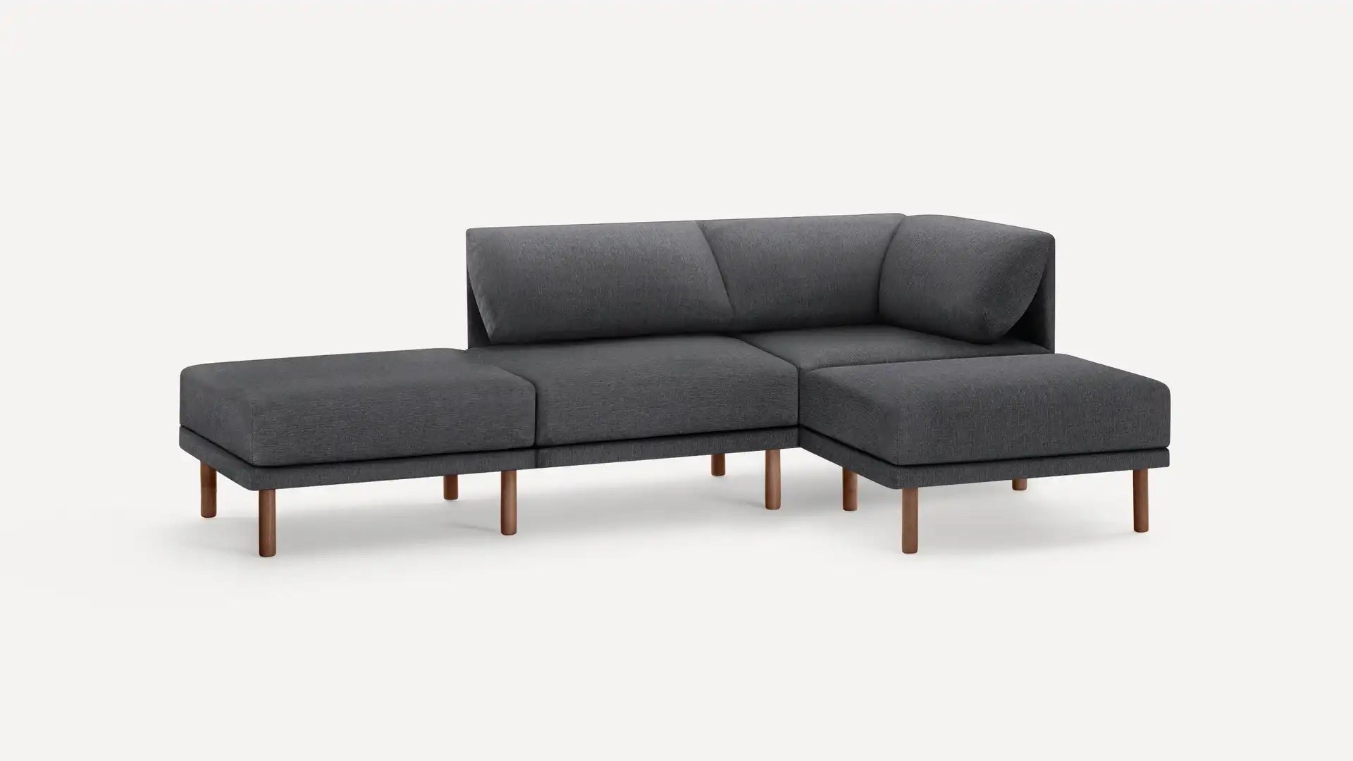 Against a plain white background, the Range Fabric 4-Piece Open Sectional Double Lounger Sofa is displayed. This gray L-shaped sectional sofa features wooden legs and showcases clean lines with a modern design, including a chaise extending on the left side.