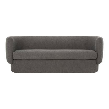 The Koba Sofa, featuring a modern minimalist design with rounded armrests and a sleek gray finish, is set against a plain white background.