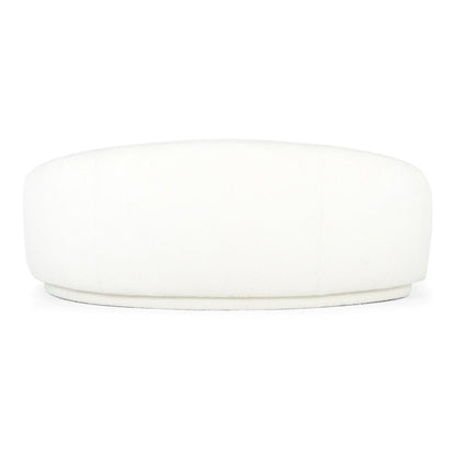 A large, round Excelsior Sofa Cream ottoman features a smooth, cushioned surface. Its minimalistic design makes it suitable for modern interiors, and it stands out against a plain white background.