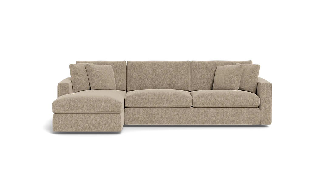 Introducing the James 3 Seat Left Chaise 92" Sectional, a beige sectional sofa featuring three large seat cushions and a left chaise lounge. The backrest is adorned with five plush cushions, complemented by wide armrests on each end. The sofa is elegantly displayed against a plain black background.