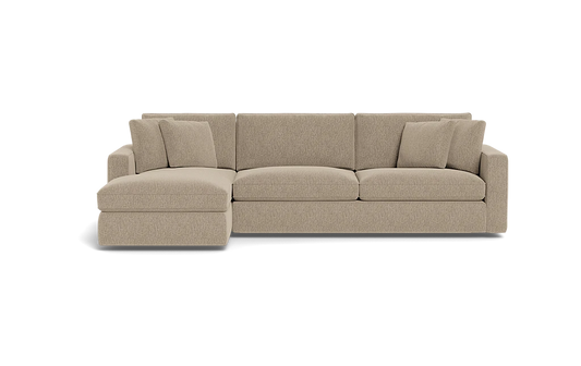 Introducing the James 3 Seat Left Chaise 92" Sectional, a beige sectional sofa featuring three large seat cushions and a left chaise lounge. The backrest is adorned with five plush cushions, complemented by wide armrests on each end. The sofa is elegantly displayed against a plain black background.