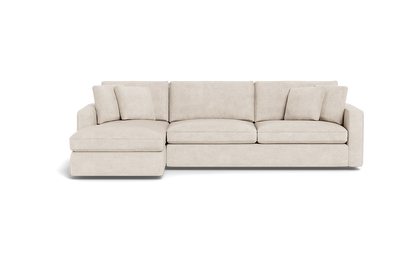 The James 3 Seat Left Chaise 92" Sectional is a beige sofa with an extended left-side chaise, three seat cushions, multiple back cushions, and is showcased against a black background. Its modern and minimalist design highlights clean lines.