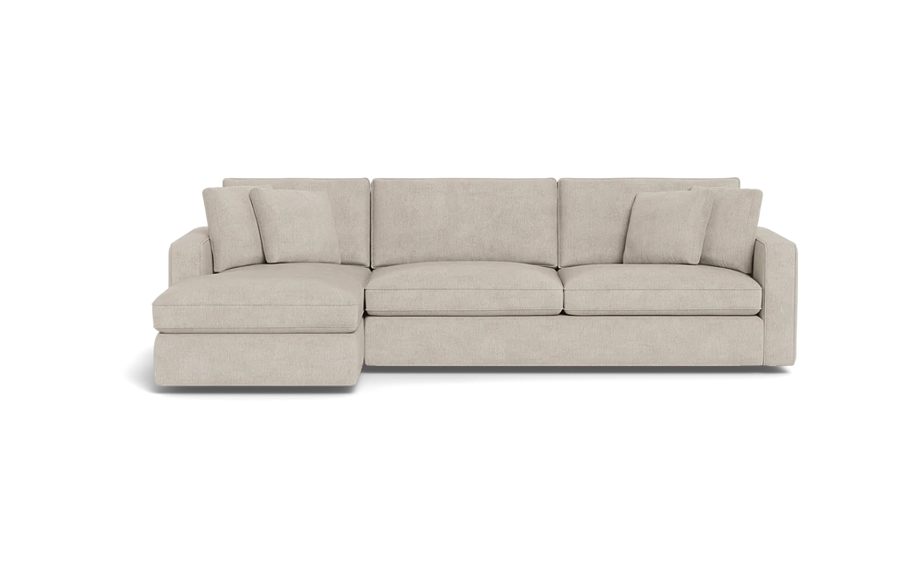 The James 3 Seat Left Chaise 92" Sectional boasts a modern, light beige color and an L-shaped design against a black background. It includes three seat cushions, back cushions, and two square throw pillows for a sleek and comfortable seating arrangement.