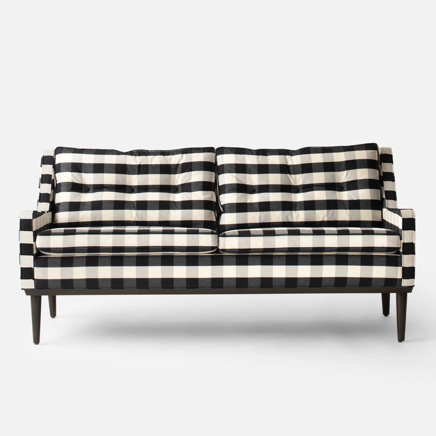 Introducing the Jack Sofa: a sleek and modern black and white checkered piece featuring two cushioned seats and a high backrest, complemented by stylish wooden legs. Perfectly showcased against a plain white background.