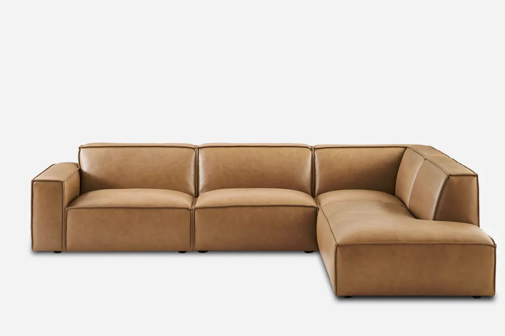 A Jonathan Leather Extended Side Chaise Sectional in brown, featuring a contemporary design with clean lines and plush cushions, displays three seats on the left and a chaise on the right against a plain white background.