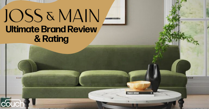 An elegant living room with a green velvet sofa, a white round coffee table with books and a plant, and a large green plant in a black vase. The text reads "Joss & Main Ultimate Brand Review & Rating" with the Couch brand logo visible at the bottom left.