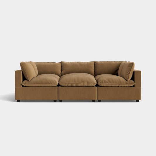 The Kova Pit is a modern, modular sectional sofa featuring a minimalist design with three cushioned seats and pillow-like back support. It comes in brown and is set against a white background.