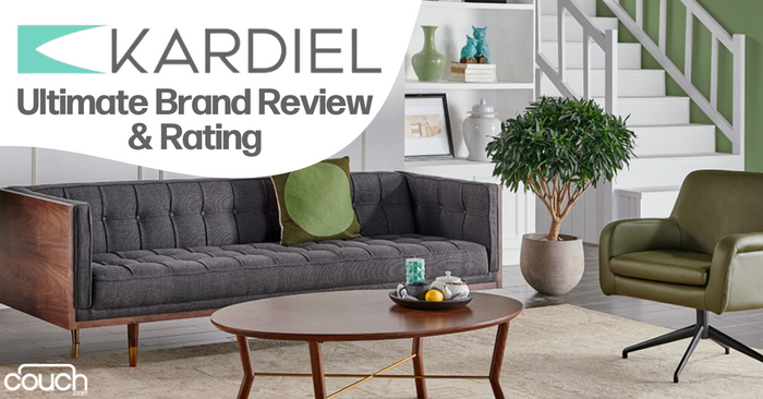 A modern living room features a dark grey tufted sofa with wooden legs, a round wooden coffee table, a green upholstered lounge chair, and a potted plant. Stairs with a white railing are in the background. The text reads "Kardiel Ultimate Brand Review & Rating.