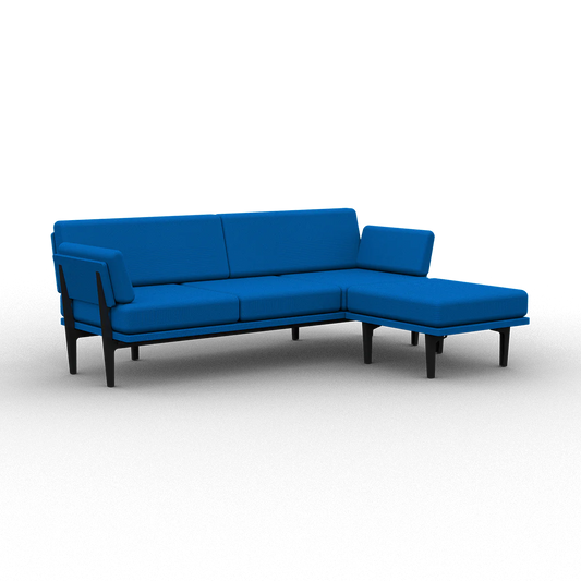 Introducing The Sofa 2.0: a contemporary L-shaped sectional sofa featuring vibrant blue cushions and sleek black wooden legs. Its armless design and minimalist style make it an ideal choice for modern living spaces.