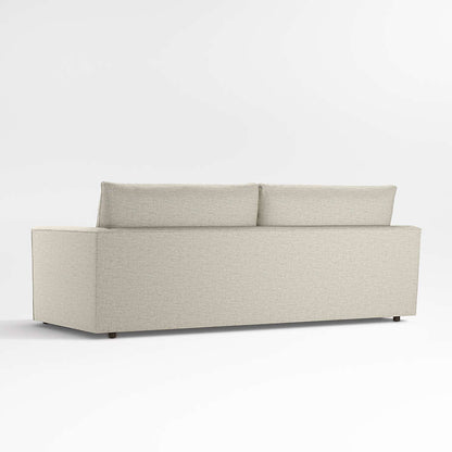 Back view of the Lounge Deep Sofa 93", a modern, minimalist piece in light gray with rectangular cushions set against a white background. The sofa features a simple, boxy design and is finished with textured fabric.