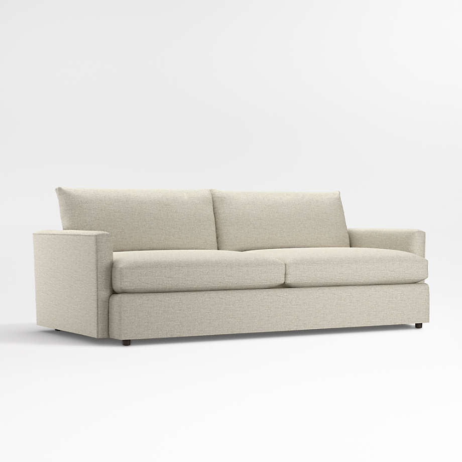 The Lounge Deep Sofa 93" is a light beige sofa that boasts clean lines and a minimalist design, featuring two large seat cushions and two back cushions set against a plain white background.