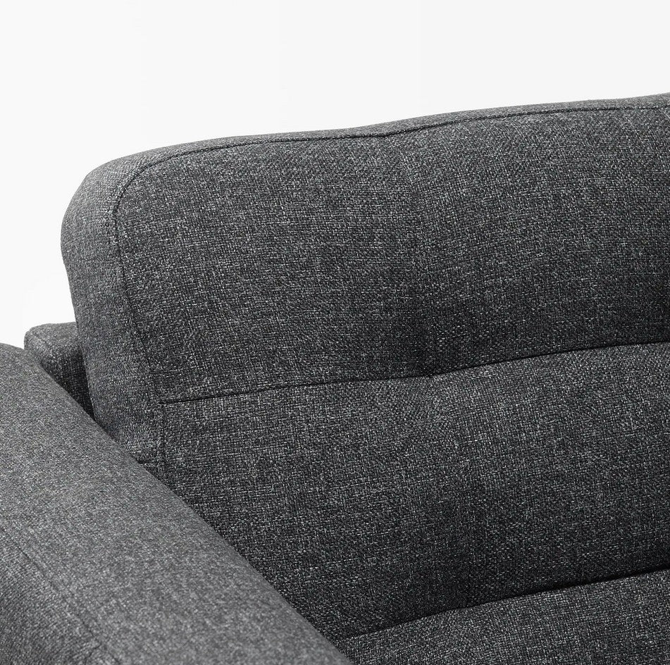 Close-up view of the MORABO Sofa in dark gray upholstery, highlighting the cushioned backrest and armrest with a focus on the fabric texture and stitching details.