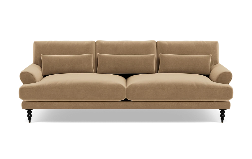 The Maxwell Custom Sofa is a tan, three-seater with plush cushions and rounded armrests, set on dark carved legs, shown from the front against a white background.