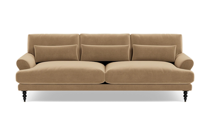 The Maxwell Custom Sofa is a tan, three-seater with plush cushions and rounded armrests, set on dark carved legs, shown from the front against a white background.