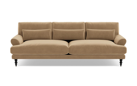 The Maxwell Custom Sofa is a tan, three-seater with plush cushions and rounded armrests, set on dark carved legs, shown from the front against a white background.