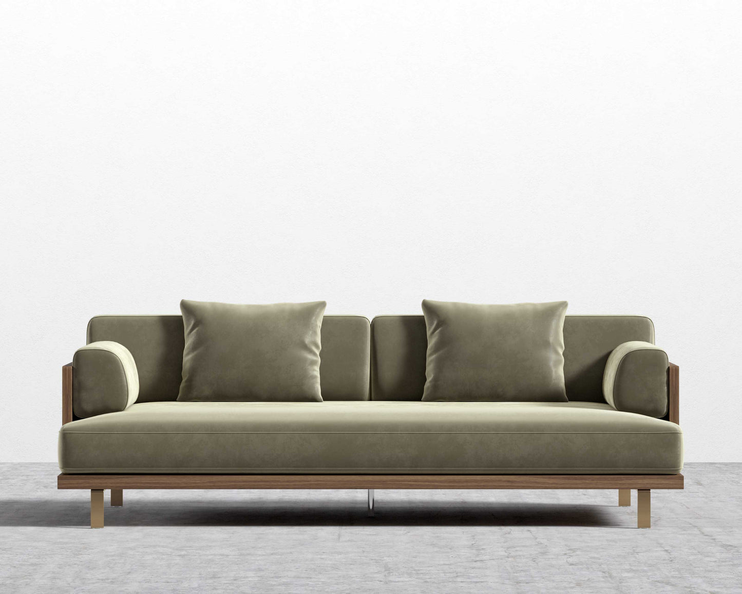 The Maria Sofa boasts a modern, minimalist design in olive green, complemented by clean lines and plush cushions against a plain white backdrop. It features wooden legs and a sleek aesthetic for a contemporary appearance.